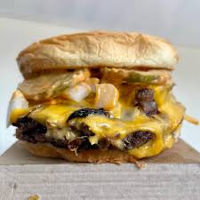Sonic double smashed burger 2026 with two beef patties, melted cheese, onions and pickles
